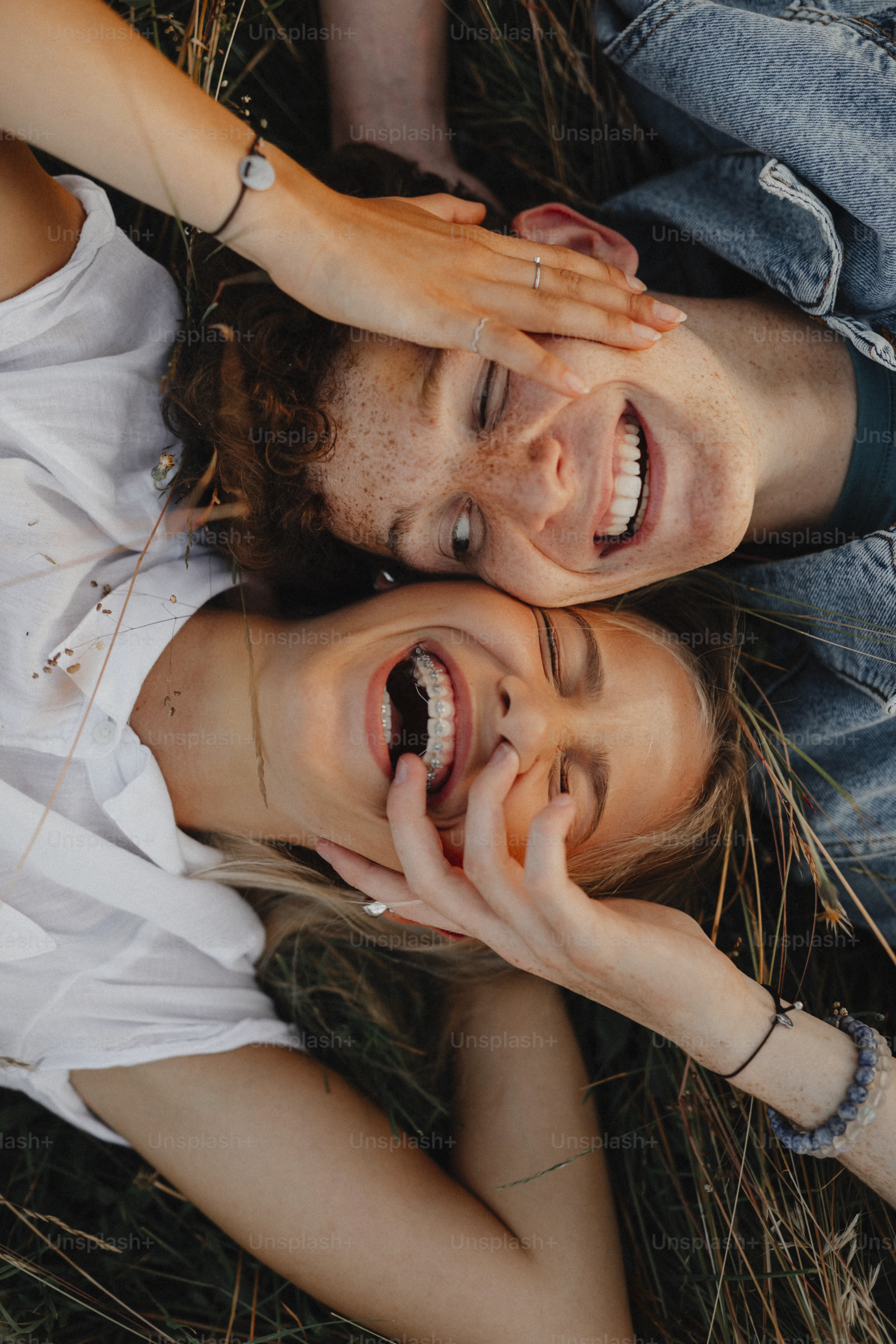 Two students laughing together